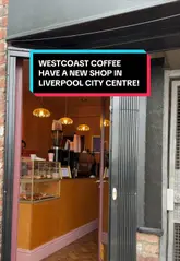 A short, handheld video tour of the new West Coast Coffee shop in Liverpool. The video captures the exterior, the interior space, the menu board, and close-ups of the coffee and pastry selection, providing a quick overview of the new venue.