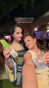 The video features two creators visiting Clays in Birmingham, highlighting the interactive shooting game experience. It includes shots of the gameplay, the venue's atmosphere, and a variety of food and drinks, such as burgers and loaded fries, presented as a fun group activity.