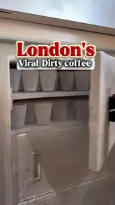 A couple visits a London cafe to try the viral 'dirty coffee' trend, highlighting the unique preparation method involving frozen glasses and the layered espresso-milk presentation.