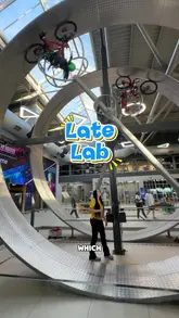 A high-energy vlog-style video showcasing a visit to Explorium in Dublin. The creators demonstrate various interactive activities, including a soccer speed test, a hang-time challenge, a giant slide, a bicycle wheel, a speed court, and a pin art wall, highlighting the venue's appeal for adults.