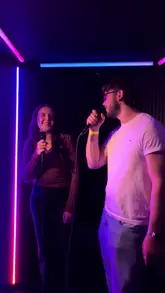A fast-paced, energetic reel showcasing a group of friends enjoying a night out at Golf Fang. The video highlights the venue's offerings, including cocktails, casual food like pizza and fries, crazy golf, AR darts, and karaoke pods.