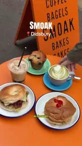 A high-energy, engaging vlog review of a bagel shop in Didsbury, Manchester, showcasing their signature 30-day cured salt beef Reuben bagel, chicken banh mi bagel, and house-baked blueberry muffins.