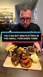 A review of 'The Ninth' in Castleford, featuring a variety of dishes including a BBQ platter, pigs in blankets, and prawns on toast. The creator provides direct feedback on the food quality and presentation.