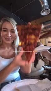 A high-energy, fast-paced reel showcasing Goldies Pizza Shop in Liverpool, featuring large New York-style pizza slices, cocktails, and a lively atmosphere with a DJ.