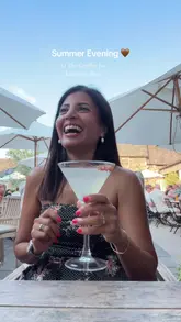 A group of friends enjoy a summer evening at The Griffin Inn in Leicestershire, showcasing the outdoor seating area, cocktails, and various pub dishes.