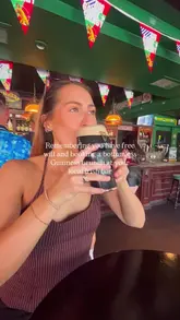 A short, casual video showcasing a bottomless Guinness brunch at an Irish bar. The creator is shown drinking Guinness, followed by shots of the venue interior and a burger and fries meal.