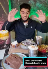 A creator visits Picasso's in Hall Green to review their range of desserts, including milkshakes, cake, cookie dough, and an acai bowl. The video features a tour of the floral-decorated interior followed by a taste test of several menu items.