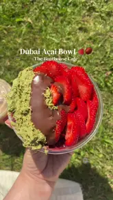 A personal vlog-style review of The Boathouse Cafe in Antrim, featuring the popular 'Dubai Açai Bowl' and an iced latte. The creator highlights the scenic waterside location and the family-friendly amenities like the nearby playground.