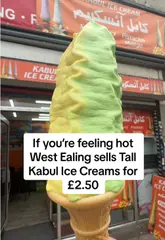 A creator reviews a tall soft-serve ice cream from Kabul Ice Cream in West Ealing, discussing the mango and pistachio flavours, the texture, and the affordable price point while walking around the venue.
