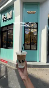 A short, energetic video showcasing the Half Million coffee shop in London, focusing on their Spanish latte and the cafe's aesthetic.