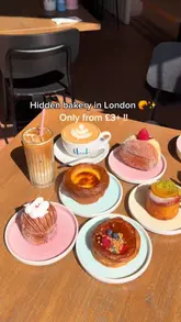 A short, visually-focused reel showcasing a variety of pastries and coffee at Heidi Bakery in Chelsea, London. The video features close-up shots of the food, including a creme brulee croissant and strawberry donut, and highlights the bakery's outdoor seating area.