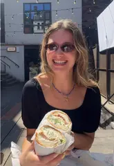 A lively, handheld vlog-style review of Granny G's at Greenroom in Leeds, featuring a taste test of their Chicken Caesar and Shrimp Po Boy subs.