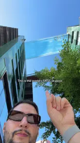A short, engaging video showcasing the world's first sky pool in London, highlighting its unique transparent design and the experience of swimming 100 feet in the air between two buildings.