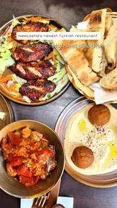 A short, punchy video showcasing the lunch menu at KÖZLE, a new Turkish restaurant in Newcastle. The edit focuses on close-up shots of various small plates, including grilled meats, falafel, and desserts, set to music with text overlays detailing the pricing deals.
