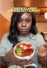 A creator visits Jinshi, a new Chinese restaurant in Woolwich, London, providing a review of the interior and a wide selection of dishes including wagyu beef puffs, dumplings, and various meat mains.