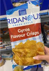 A fast-paced product haul video filmed inside a Lidl supermarket, showcasing the return of their 'Eridanos' Greek-style food range. The creator moves through the freezer and chilled aisles, holding up various items including gyros pizza, octopus, pastries, dips, and snacks to highlight the variety available.
