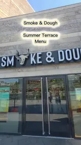 A vlog-style review of the new Summer Terrace Menu at Smoke & Dough in Liverpool, showcasing the outdoor seating, cocktails, and specific dishes like brisket mac and cheese and lamb kofta.