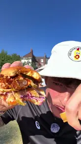 A high-energy, first-person vlog-style review of a chicken burger, featuring close-up shots of the food and the creator's enthusiastic reaction.