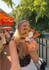 A vlog-style video featuring a visit to Common Pizza in Clapham. The creator cycles to the venue, showcases the outdoor seating area, and reviews both New York and Detroit-style pizzas, along with cocktails and fries.
