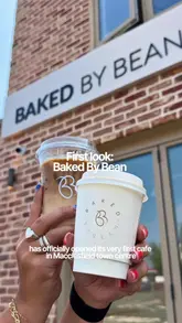A promotional video showcasing the opening of 'Baked By Bean' in Macclesfield, highlighting their fresh in-house baked goods like cookies and brownies, alongside their coffee menu and spacious new cafe interior.