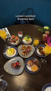 A montage video showcasing a brunch experience at The Soak in London, featuring a variety of breakfast dishes, cocktails, a live DJ, and the venue's interior decor.