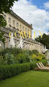 A critical review of a stay at Cowley Manor, highlighting the beautiful interiors, grounds, and food, while expressing disappointment with the service and amenities relative to the price point.