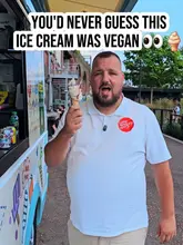 A creator reviews a vegan soft-serve ice cream from an ice cream van located at Mayfield Park in Manchester, highlighting its suitability for those who are lactose intolerant.
