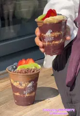 A promotional video for Oakberry's 1st anniversary in Edinburgh, showcasing their açaí bowls and announcing a giveaway of 50 free bowls on July 19th.