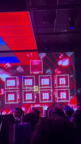 The video is a vlog-style review of Hijingo, a bingo-themed venue in London. The creator highlights the bottomless experience, showcasing the interactive bingo games, the atmosphere, the cocktails, and the food options like burgers and fries. The video uses a mix of shots of the venue, the game, and the creator's reactions to convey the fun, high-energy nature of the experience.