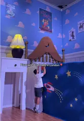 A short, energetic tour of the Pixar World exhibition in London, showcasing various themed rooms and photo spots inspired by popular Pixar films like Toy Story, Ratatouille, and Cars. The video features a creator walking through the space, highlighting the immersive nature of the experience.