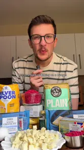 A home cooking tutorial demonstrating how to make a copycat version of M&S raspberry and white chocolate cookies using an air fryer.