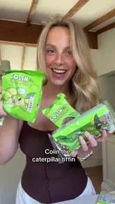 A creator demonstrates a no-bake recipe for a 'Colin the Caterpillar' tiffin using M&S products, including melting chocolate, mixing with biscuits, and decorating with white chocolate and caterpillar-themed sweets.