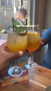 A short video showcasing a visit to Bella Italia, featuring various spritz cocktails, pizza, pasta, calamari, and garlic bread. The video includes shots of the menu, the food being served, and the restaurant's interior and exterior.