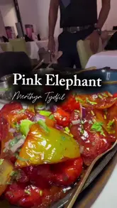 Two creators visit The Pink Elephant Indian restaurant in Merthyr Tydfil, reviewing the starters, mains, and sides, highlighting the service and food quality.