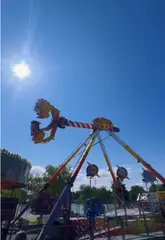 A creator visits the Xtreme Funfair at Rushmere Shopping Centre, providing a tour of the rides and games while sharing practical information like opening times and the token system.