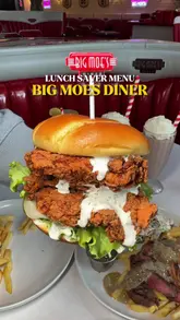 A promotional video for Big Moe's Diner showcasing their 'Lunch Saver Menu' with various dishes including a double stacker burger, steak, wings, and dessert.