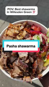 A short, punchy review of Pasha Shawarma in Willesden Green, featuring close-ups of the meat, the preparation process, and the creator enjoying the food.