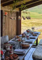 The video documents a group trip to the Straloch Estate in the Cairngorms, Scotland. It follows the journey to a remote, renovated bothy where a private picnic experience is hosted by the estate's resident chef. The content highlights the scenic location, the accommodation at The Schoolhouse, and the spread of food and drinks provided, creating an aspirational and relaxing atmosphere.