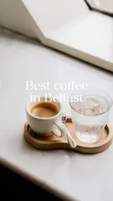 The video features two creators visiting a coffee shop called Neighbourhood Cafe in Belfast, showcasing their coffee and baked goods, followed by a brief mention of a local pub.