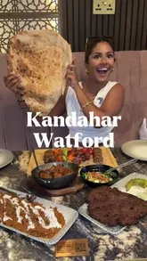 A couple visits Kandahar restaurant in Watford to review their Afghan cuisine, showcasing various dishes like mixed grill, chapli kebab, and charsi lamb, while highlighting the restaurant's atmosphere and kitchen.