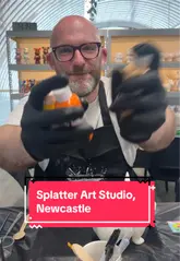 A couple visits Splatter Art Studio in Newcastle to participate in a 'pour art' workshop. The video shows the process of selecting figures, choosing paint colors, and the final results, while also highlighting the venue's 'splatter art' room.
