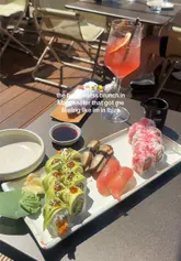 A promotional reel showcasing a bottomless brunch experience at Sticks and Sushi in Manchester, featuring close-ups of sushi platters, cocktail pouring, and the lively outdoor dining atmosphere.