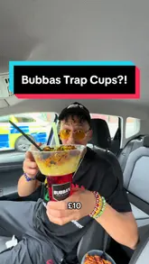A high-energy, vlog-style review of a 'Trap Cup' from Bubba's Trap Kitchen, which combines a food container and a drink cup into a single, one-handed unit, ideal for festivals and outdoor events.