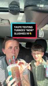 A mother and son taste-test new slushie flavours from Tubbees while sitting in their car. They try root beer, cherry berry lemonade, and mango flavours, providing candid reactions to each.