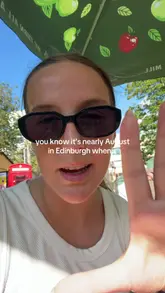 A creator walks through George Square Gardens in Edinburgh, announcing that the venue is officially open for the festival season. The video captures the outdoor setting, the setup of the space, and ends with a casual drink.