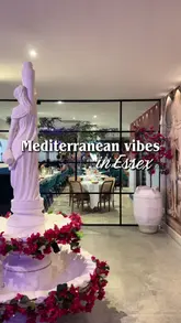 A promotional video for Yiamas restaurant in Essex, featuring shots of the Mediterranean-inspired interior, a variety of cocktails, and several small plates including bruschetta, hummus, and pasta dishes.