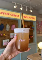 A couple visits Rise Brunch in York, showcasing their menu items including acai bowls, bagels, banana bread, and various iced drinks. The video features quick cuts of the food, the interior, and the creators enjoying their meal.