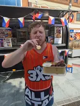 A creator reviews a Filipino food truck in Cardiff, highlighting the pork adobo meal deal. The video features the creator interacting with the staff, tasting the food, and providing an enthusiastic recommendation.