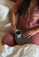 A short, aesthetic 'day in the life' video showcasing a stay at Mollie's Motels, featuring skincare, brunch, relaxing in the room, and evening drinks.