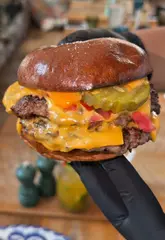 A review of Cabana, a Brazilian restaurant in London, highlighting their halal-friendly menu options including grilled chicken, smash burgers, tacos, and desserts.